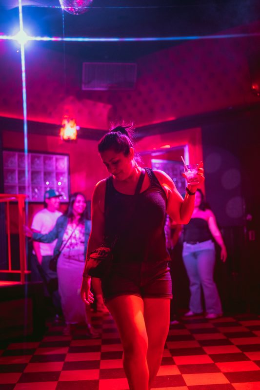 Red-lit bar room during State Fest